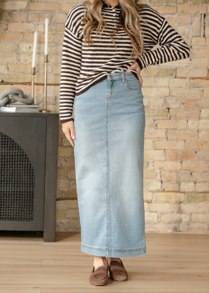 Light wash denim maxi skirt by Inherit Co. featuring a flowy silhouette, high waist, and casual, stylish design.