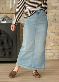 Light wash denim maxi skirt from Inherit Co.'s IC Skirts collection, featuring a flowing, full-length denim design.