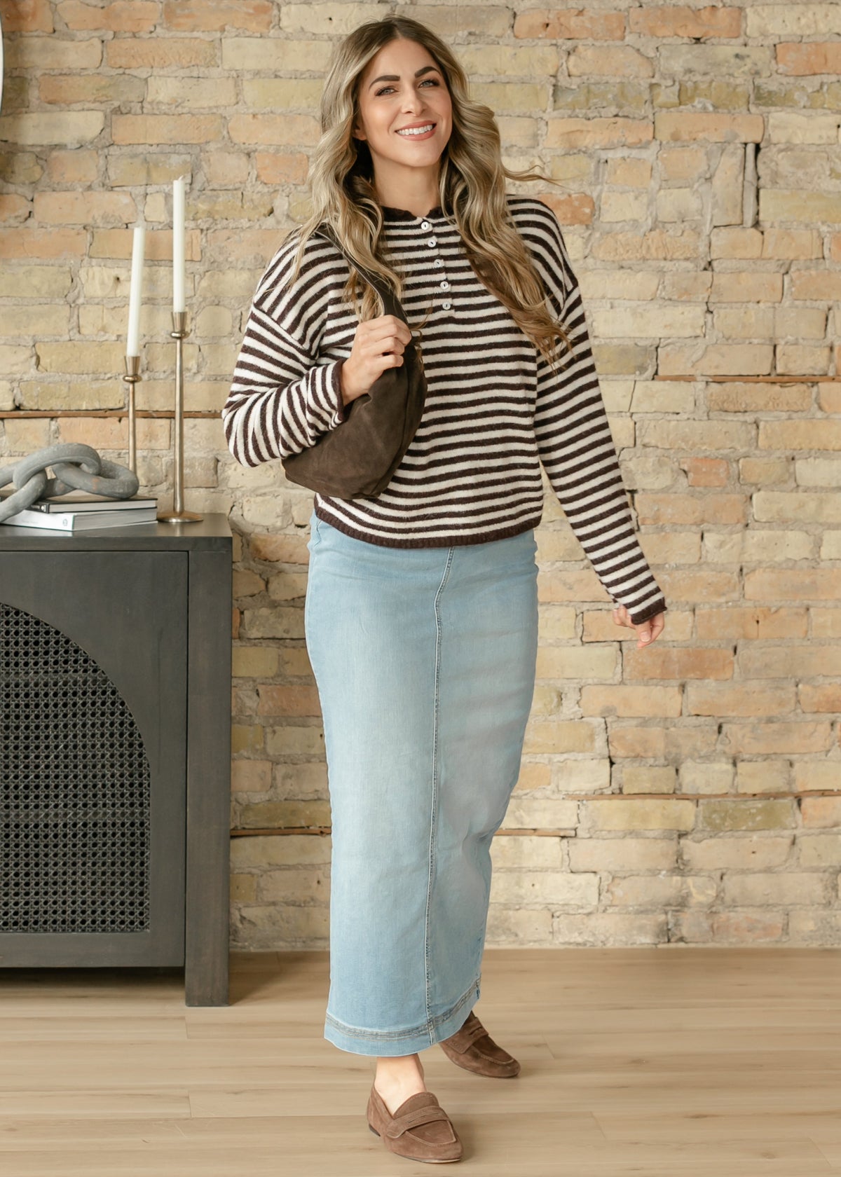 Light wash denim maxi skirt by Inherit Co. from the IC Skirts collection, featuring a flowing silhouette and casual style.