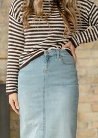 Light wash denim maxi skirt from Inherit Co.'s IC Skirts collection, featuring a flowing, full-length design and classic denim texture.