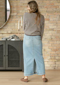 Light wash denim maxi skirt from Inherit Co., part of IC Skirts collection, shown in a full-length view.