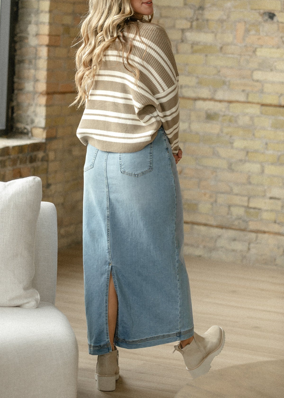 Light wash denim maxi skirt from Inherit Co.'s IC Skirts collection, featuring a flowing design and high-waisted fit.