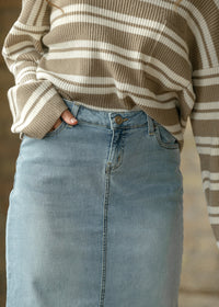 Light wash denim maxi skirt from Inherit Co.'s IC Skirts collection, featuring a flowing, full-length design with a casual, stylish look.