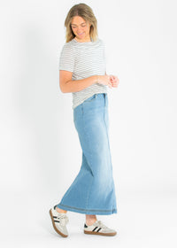 Light wash denim maxi skirt from Inherit Co.'s IC Skirts collection, featuring a flowing, full-length design with a casual style.