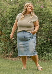 Inherit Co. Drew Raw Hem Midi Denim Skirt featuring a classic blue denim fabric and a raw hem design.