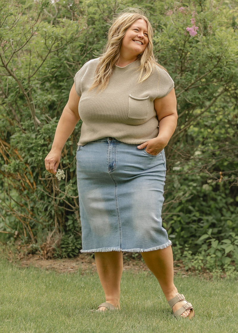 Inherit Co. Drew Raw Hem Midi Denim Skirt featuring a classic blue denim fabric and a raw hem design.