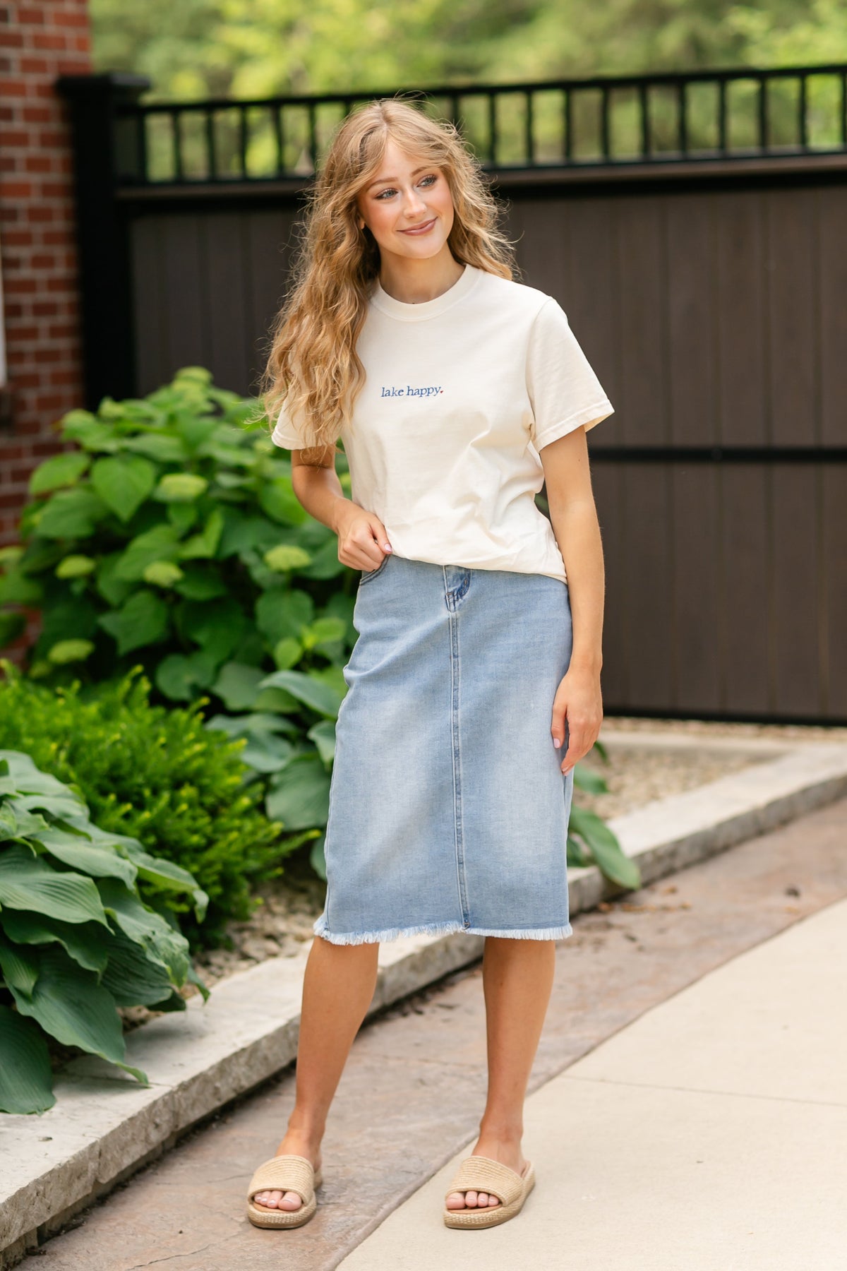 Inherit Co. Drew Raw Hem Midi Denim Skirt featuring a classic blue denim fabric with a raw hem and midi length style.