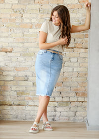 Inherit Co. Drew Raw Hem Midi Denim Skirt featuring a classic denim design with a raw hem finish.