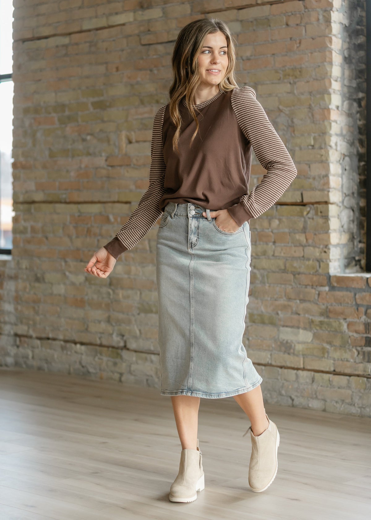 Light wash midi denim skirt from Inherit Co.'s IC Skirts collection, featuring a classic fit and stylish design.