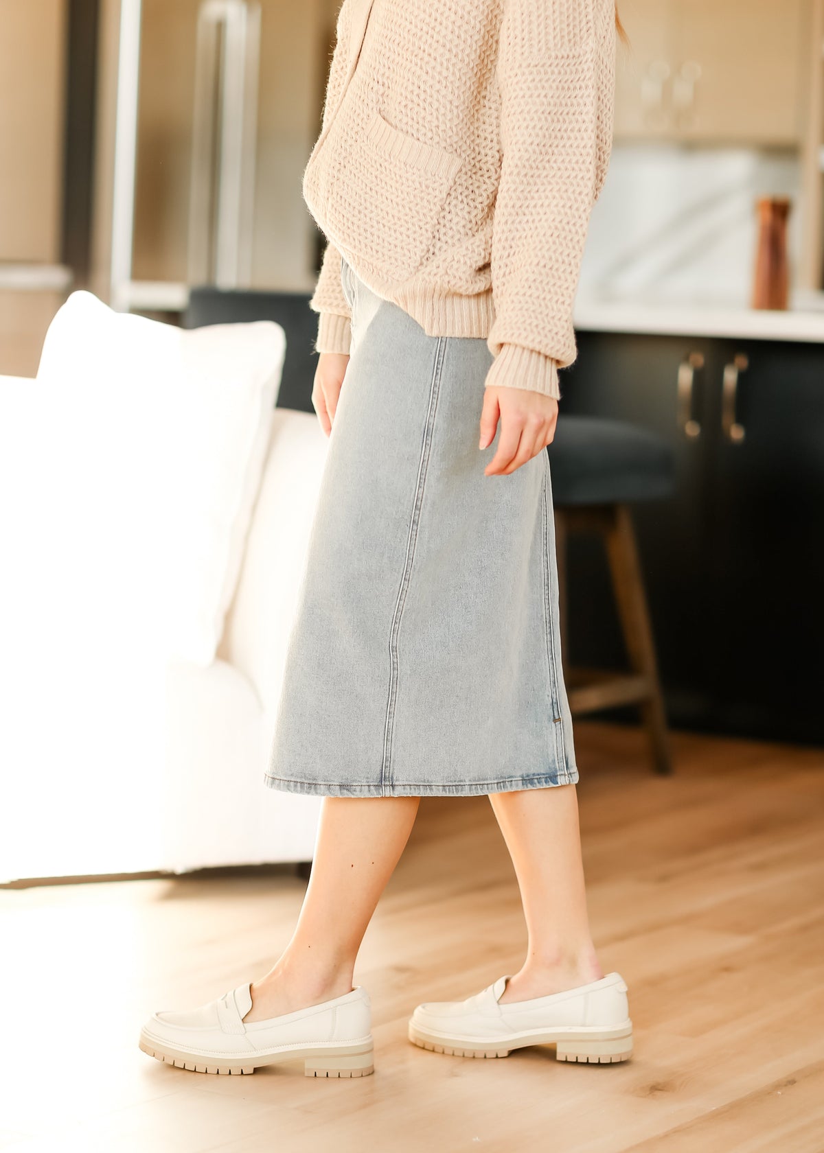 Light wash midi denim skirt by Inherit Co. from the IC Skirts collection, featuring a classic denim design and midi length.