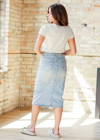 Inherit Co. Greta light wash midi denim skirt from IC Skirts collection, styled with casual top and shoes.