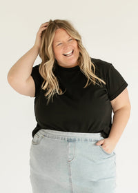 Inherit Co. Sandra light wash denim midi skirt with a classic fit, shown with a short-sleeve basic tee, perfect for casual styling.