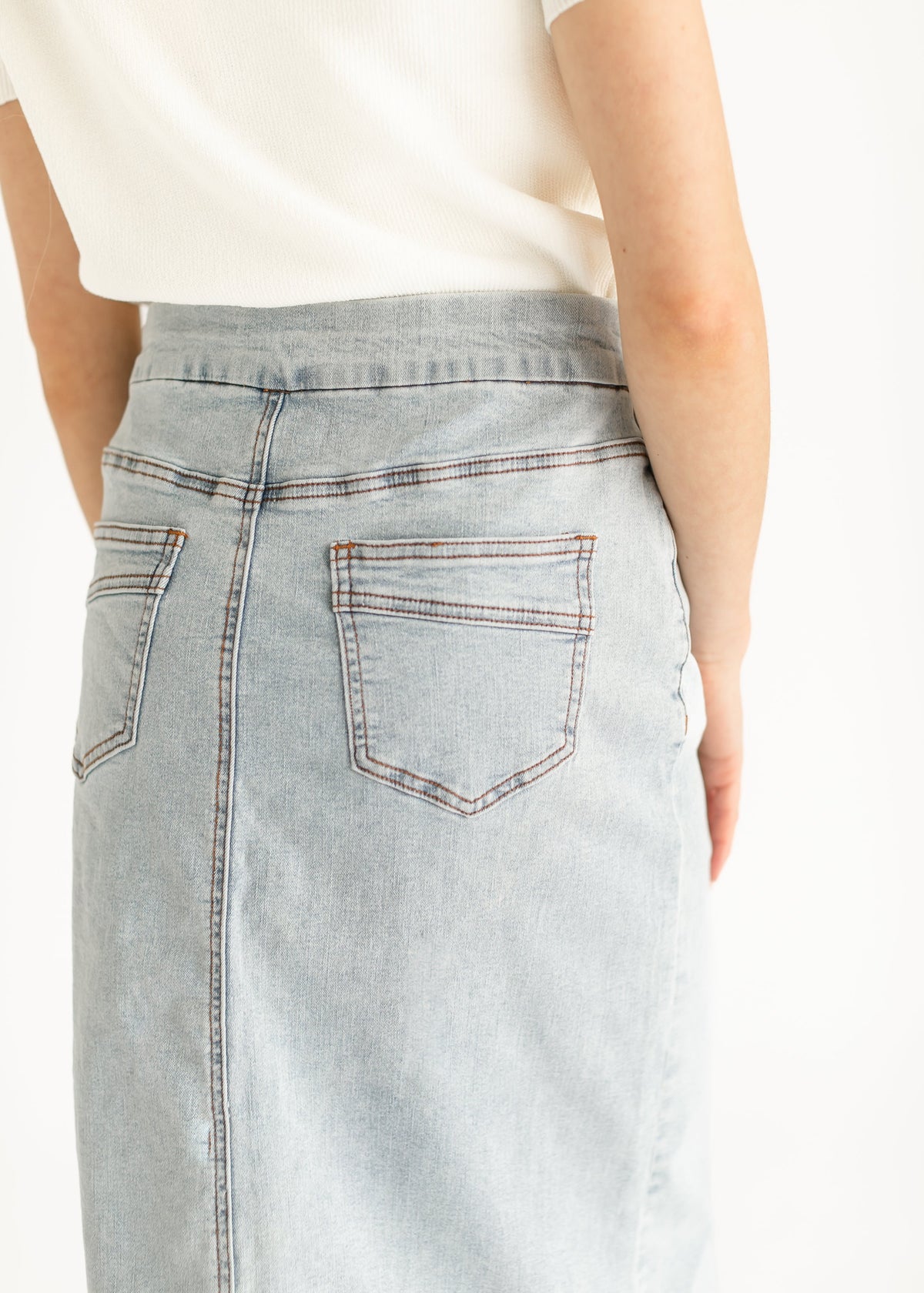 Inherit Co. Sandra Light Wash Denim Midi Skirt from IC Skirts, casual style with a mid-length fit and classic denim texture.