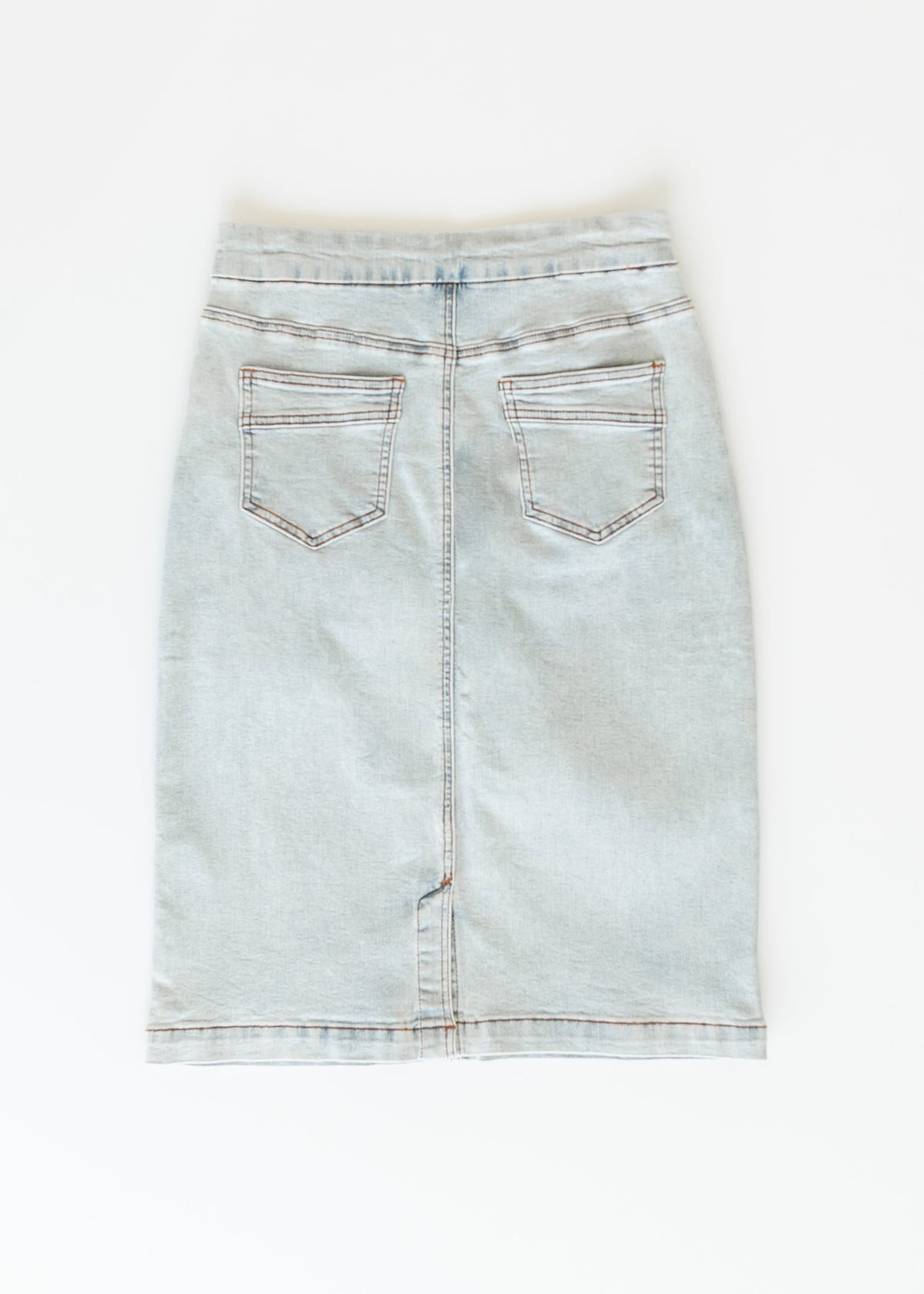 Inherit Co. Sandra light wash denim midi skirt, casual style with a high waist and A-line silhouette, shown on a model.