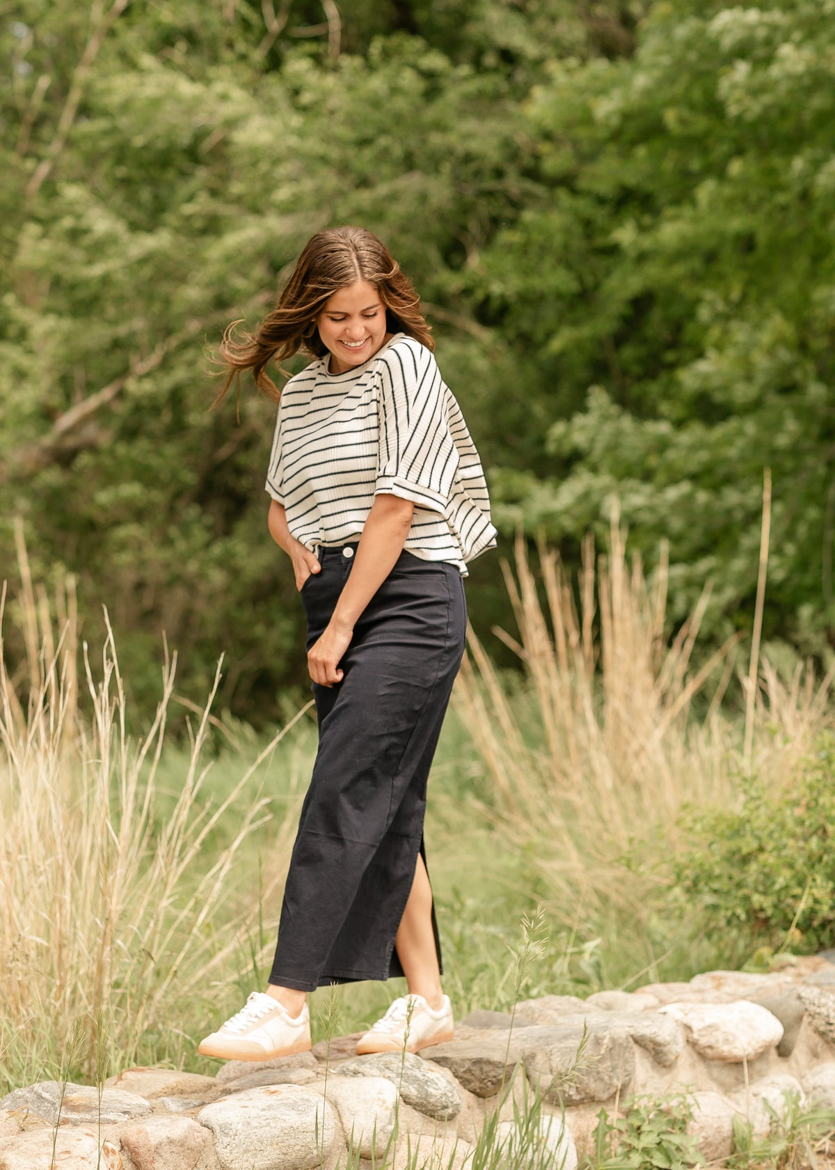 Inherit Co. Stella navy maxi denim skirt featuring a flowing design and classic denim texture, full length and stylish.