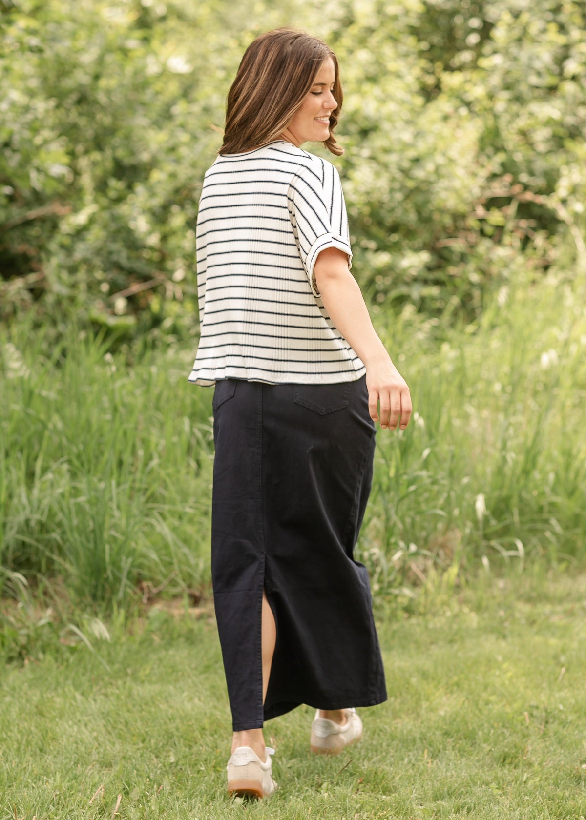 Inherit Co. Stella navy maxi denim skirt with flowing design and waistband, styled for casual or dressy occasions.
