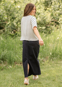 Inherit Co. Stella navy maxi denim skirt with flowing design and waistband, styled for casual or dressy occasions.