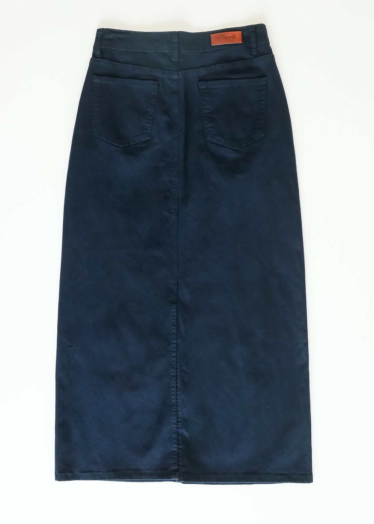 Inherit Co. Stella Navy Maxi Denim Skirt with high waist and flowing length, styled with casual top and accessories.
