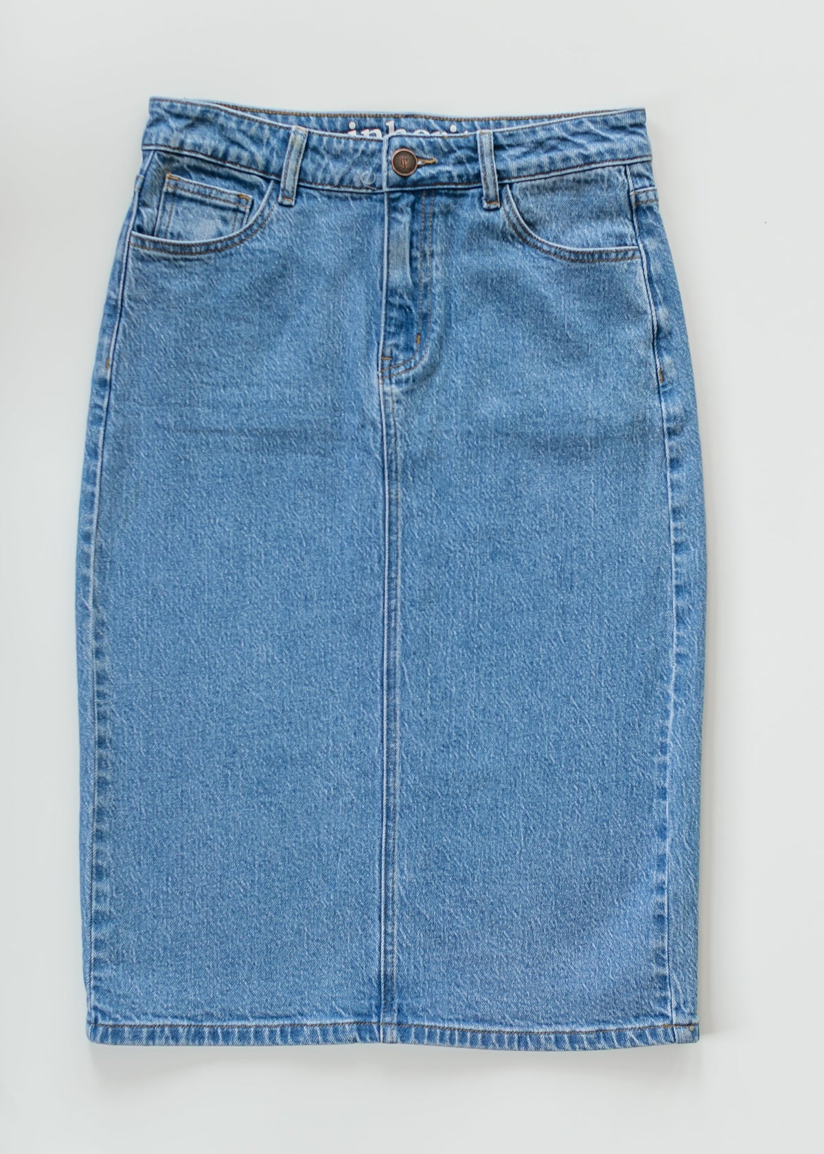 Inherit Co. Remi Denim Classic Wash Midi Skirt from IC Skirts collection, featuring a stylish denim midi length with a classic wash.