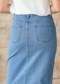 Inherit Co. Remi Denim Classic Wash Midi Skirt, stylish blue denim with a midi length, displayed on a model.