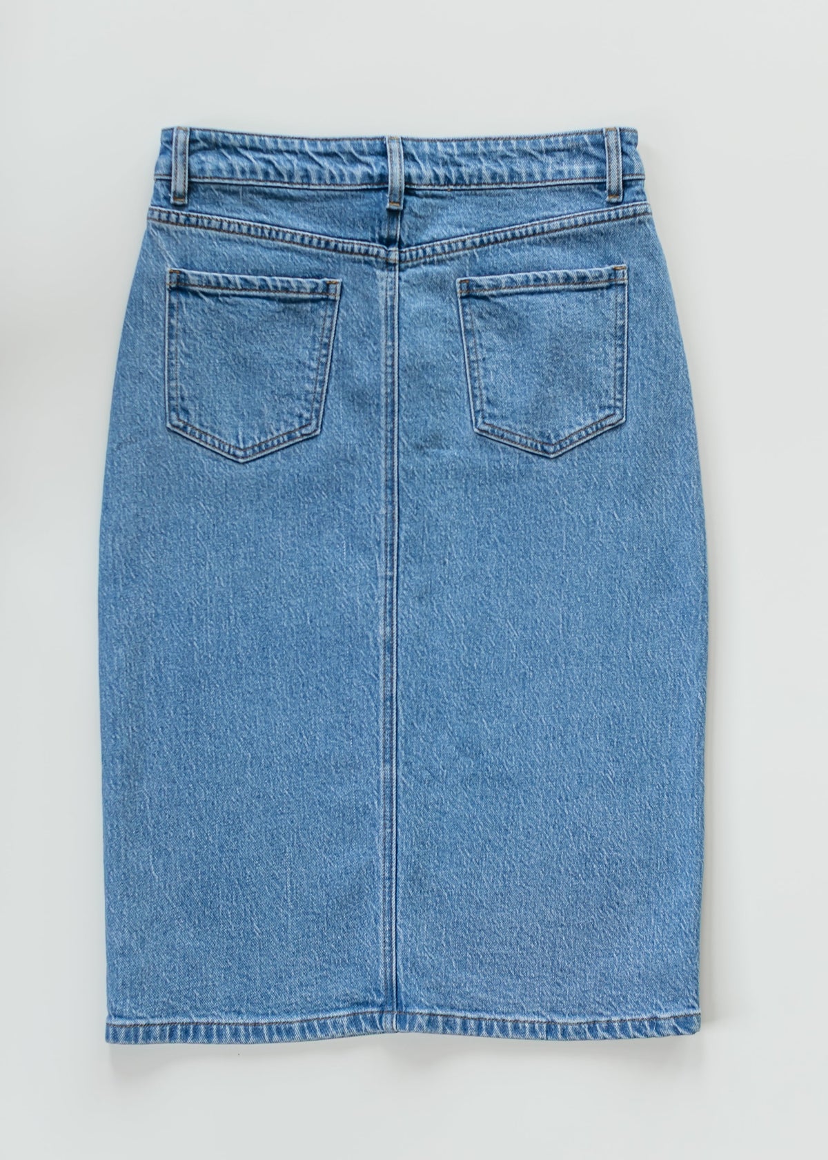 Inherit Co. Remi Denim Classic Wash Midi Skirt with a high waist and A-line silhouette, shown on a neutral background.