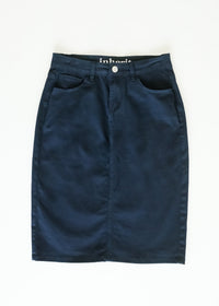 Inherit Co. Remi navy denim midi skirt with a fitted waist and knee-length hem, styled with casual top and accessories.