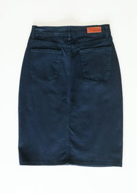 Inherit Co. Remi navy denim midi skirt displayed on model, showcasing a stylish, knee-length skirt with a classic denim look.