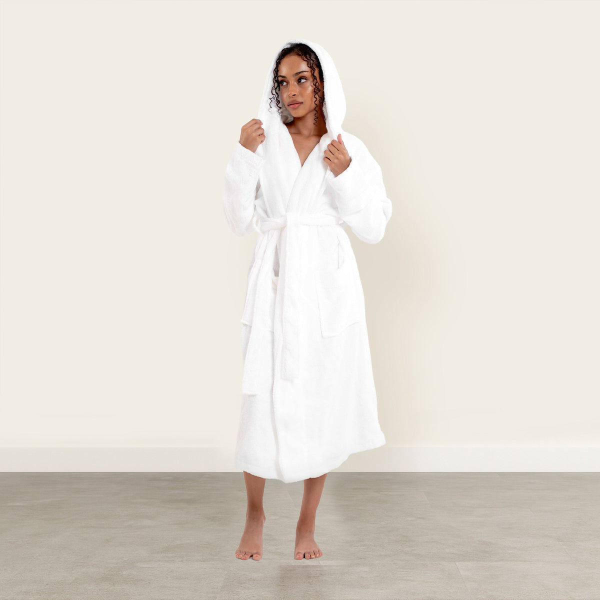 Dusk white Ultraplush Australian Cotton bathrobe by Italic, soft and plush, hanging on a hook with a cozy appearance.