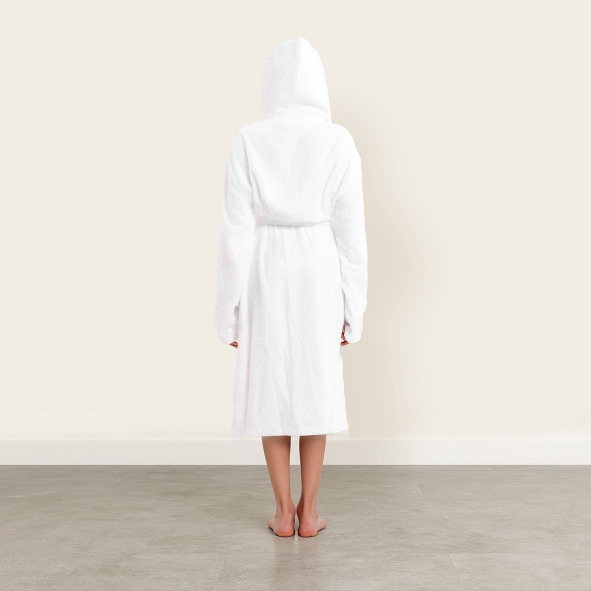Dusk white Italic Ultraplush Australian Cotton Bathrobe hanging on a hook, soft and cozy fabric, small size.