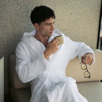 Dusk white Italic Ultraplush Australian Cotton Bathrobe hanging, soft plush fabric, cozy and comfortable for relaxing at home.
