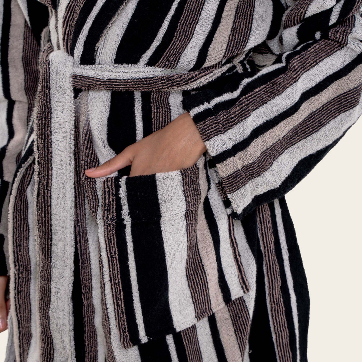 Dusk white Italic Ultraplush Australian Cotton bathrobe hanging on a hook, showcasing soft, plush fabric and relaxed fit.