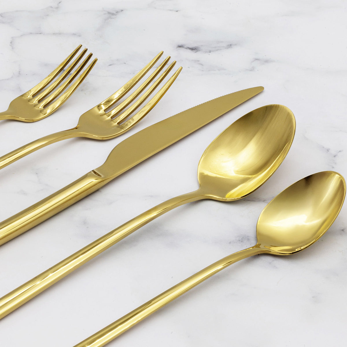 Italic Emilia Mirror 20-piece flatware set with gold finish, featuring forks, knives, spoons, and serving pieces on a white background.