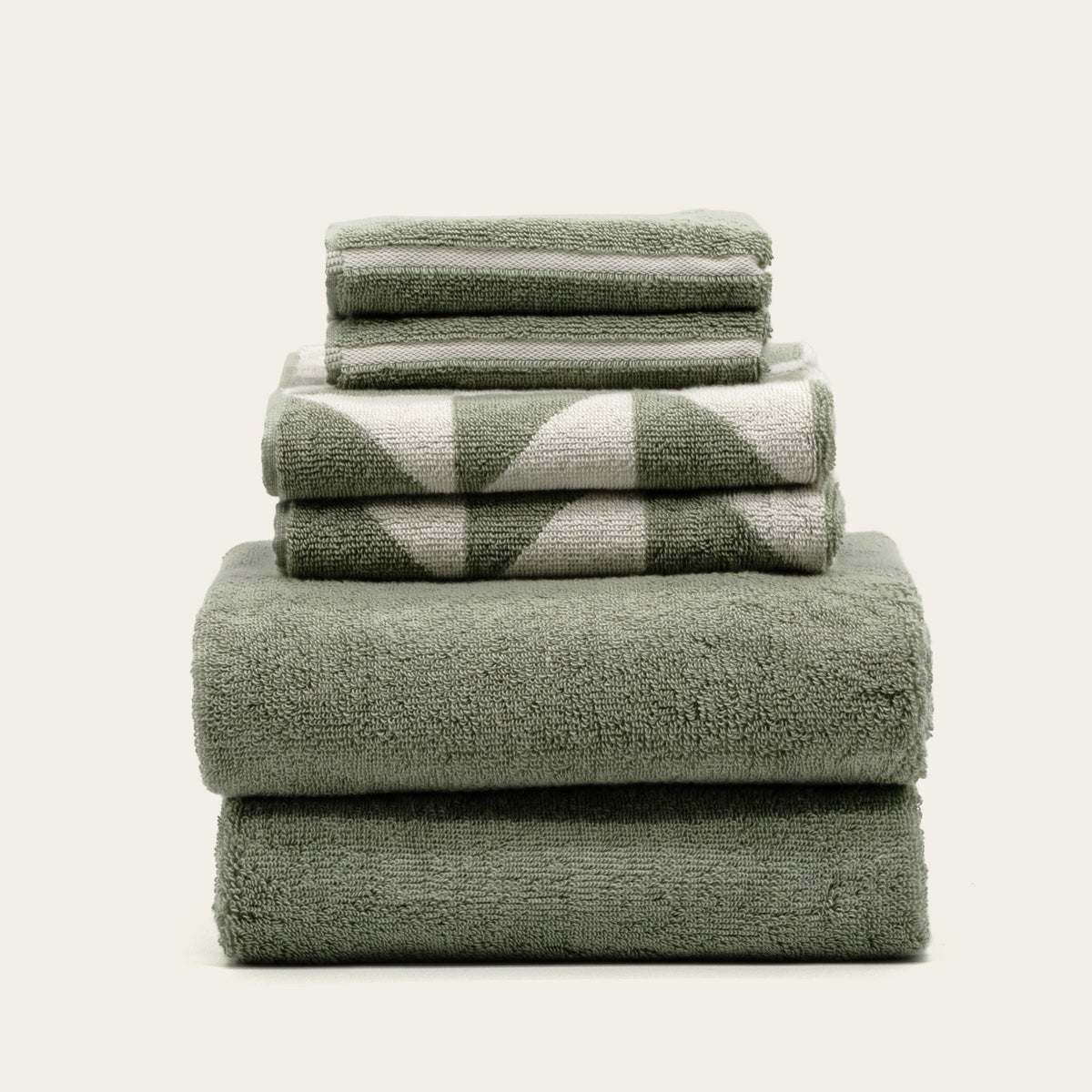 Set of two Italic Umbra bath towels in sage and ecru, soft woven home bath towels with a plush texture.