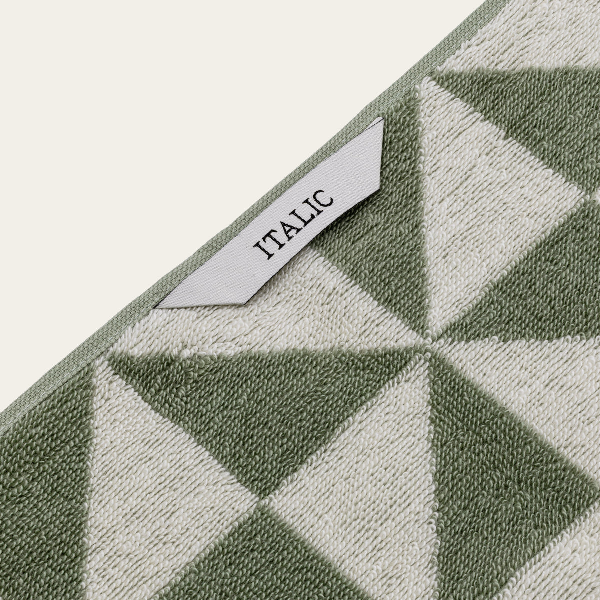 Set of two Italic Umbra bath towels in sage and ecru, soft and absorbent for home bathroom use.