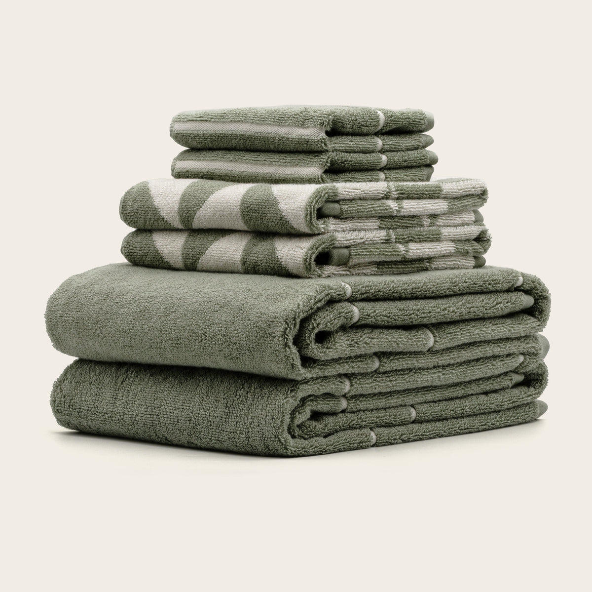 Set of two Italic Umbra bath towels in sage and ecru with a soft, plush texture for home bath use.