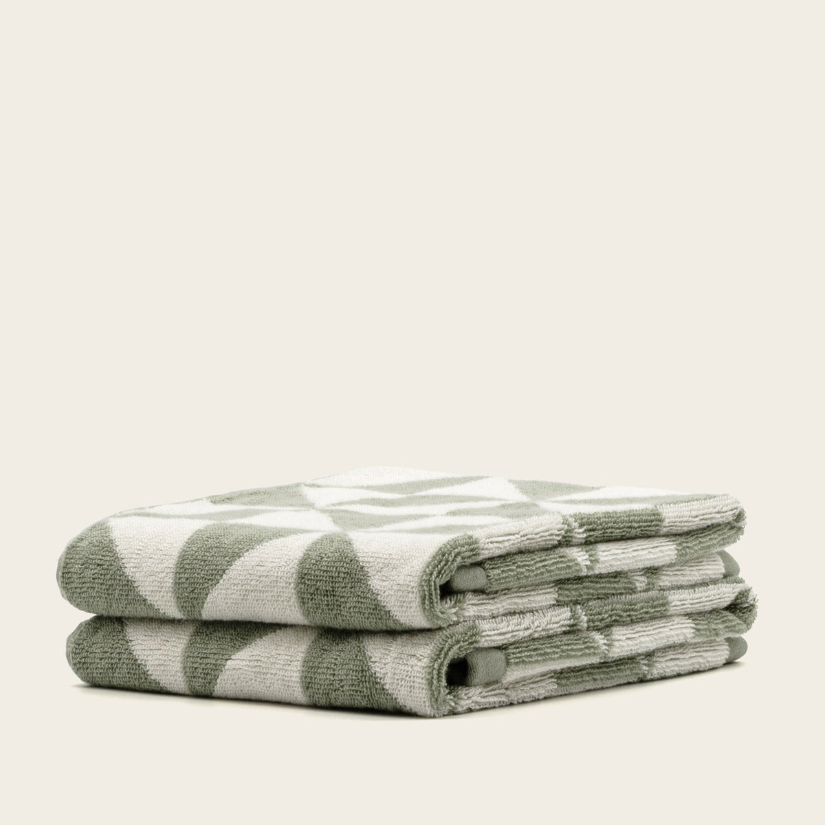 Set of two Italic Umbra bath washcloths in sage and ecru, soft home towel collection for everyday use.