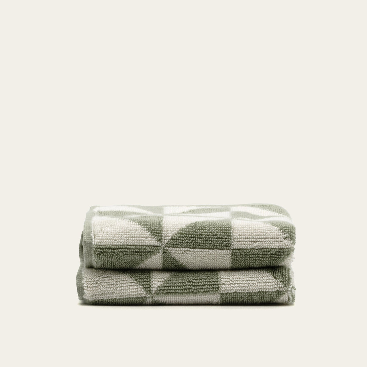 Set of two Umbra bath towels in sage and ecru from Italic, soft and plush home bath towels with a cozy, absorbent texture.