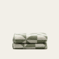 Set of two Umbra bath towels in sage and ecru from Italic, soft and plush home bath towels with a cozy, absorbent texture.
