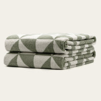 Set of two Italic Umbra bath washcloths in sage and ecru, soft cotton towels for home bath use.