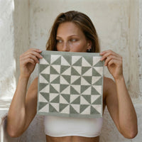 Set of two Italic Umbra bath towels in sage and ecru, soft home bath towels with a plush texture.
