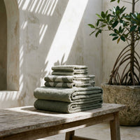 Set of two Italic Umbra bath towels in sage and ecru, soft and absorbent home bath accessories with a plush texture.