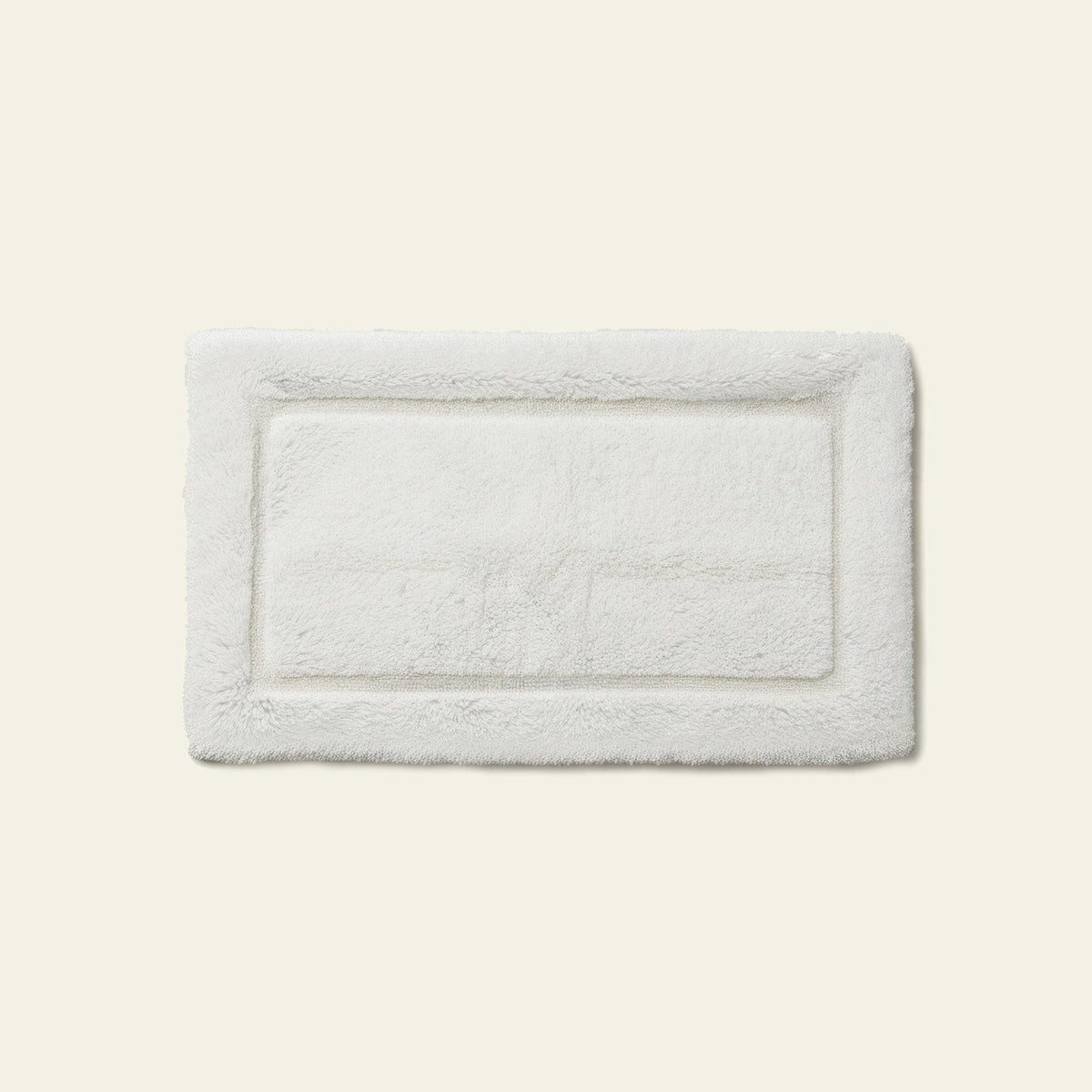 White Italic Ultraplush skid-resistant bath mat with soft, plush texture for safe, comfortable bath and shower use.