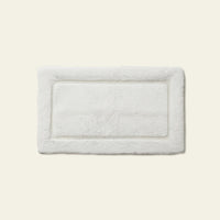 White Italic Ultraplush skid-resistant bath mat with soft, plush texture for safe, comfortable bath and shower use.