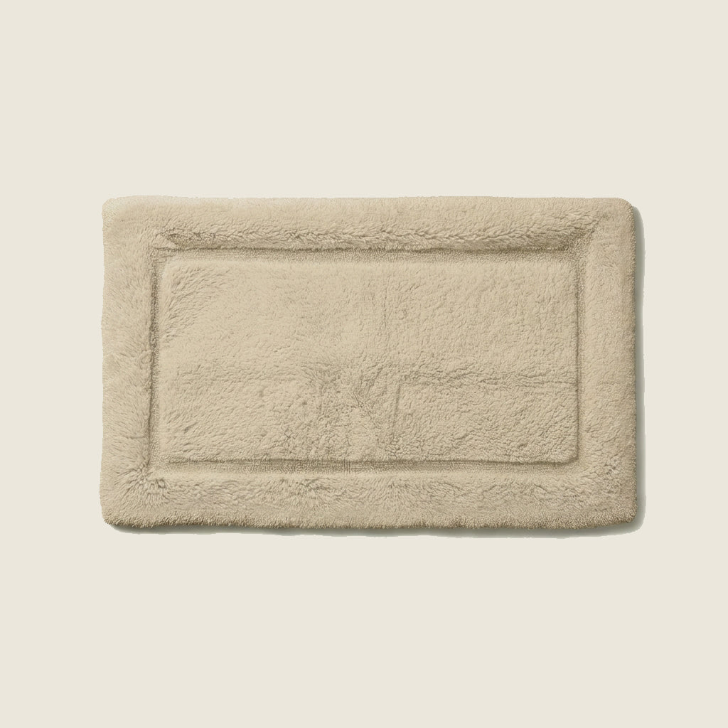 White Italic Ultraplush skid-resistant bath mat with plush texture and non-slip backing for safe, comfortable bathroom use.