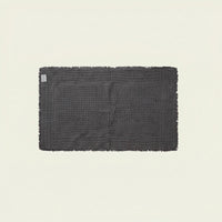 White Italic Ultraplush skid-resistant bath mat with textured surface for added safety in the bathroom.