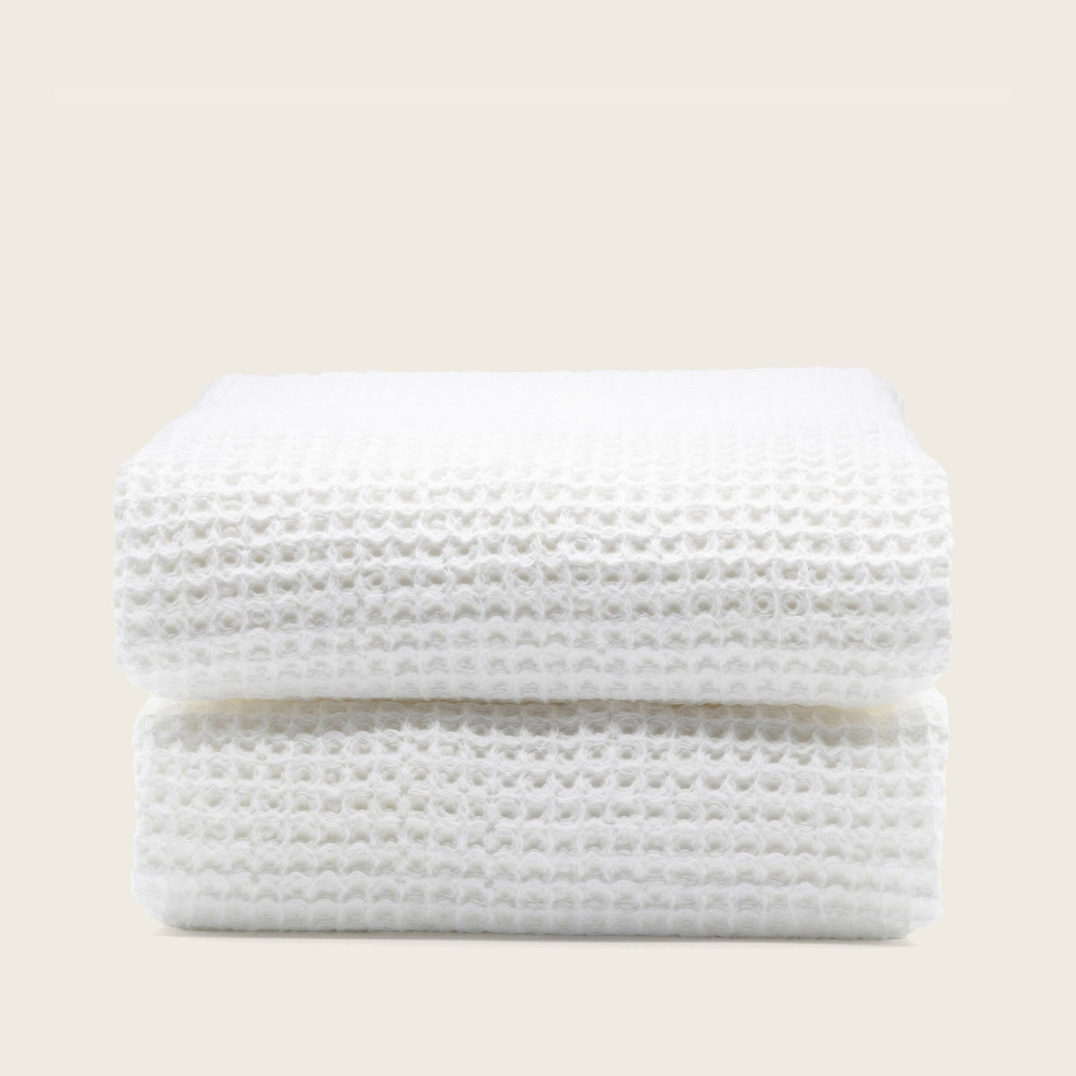Set of two white Sedona waffle bath towels by Italic, soft and absorbent for home bathroom use.