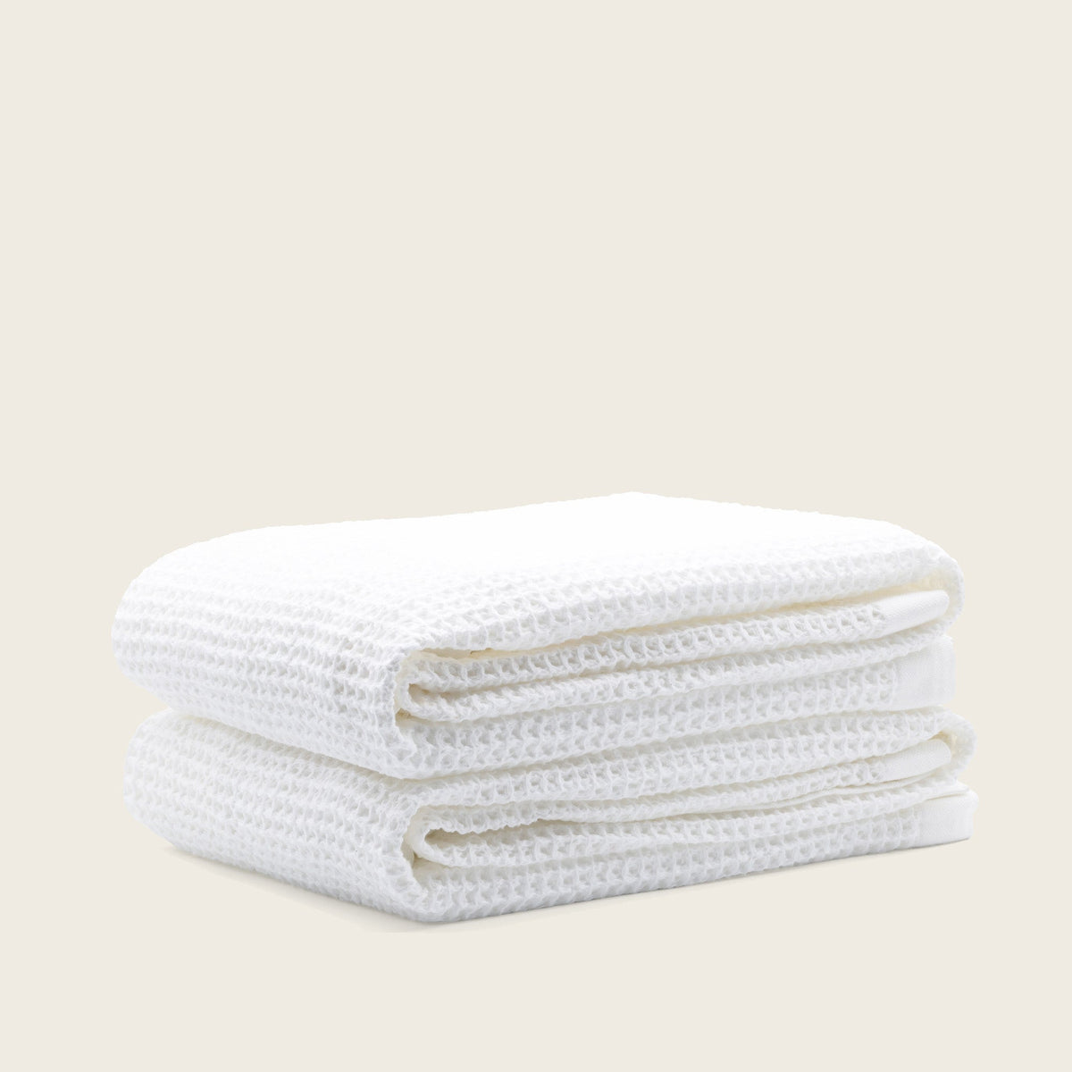 Set of two white Sedona waffle bath towels from Italic, featuring textured, lightweight fabric for a soft, absorbent home bath accessory.