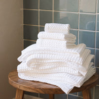 Set of two white Sedona waffle bath towels by Italic, soft and plush for home bathroom use.