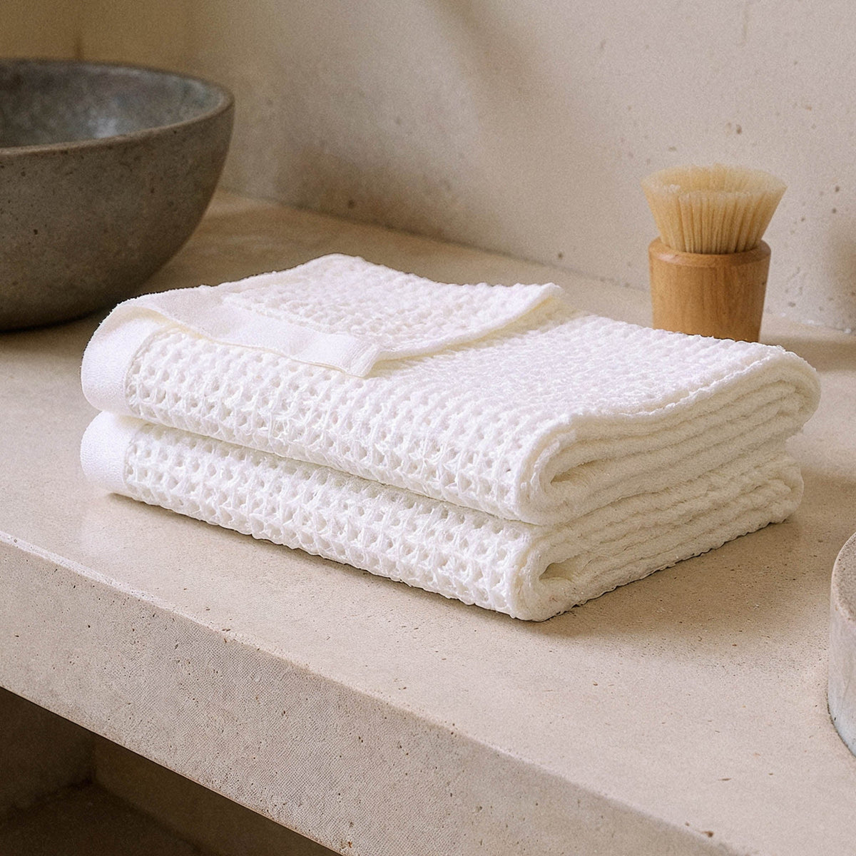 Set of two white Sedona waffle bath towels by Italic, soft and plush for home bathroom use.