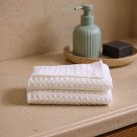 Set of two white Sedona waffle towels from Italic, soft and absorbent bath washcloths for home use.